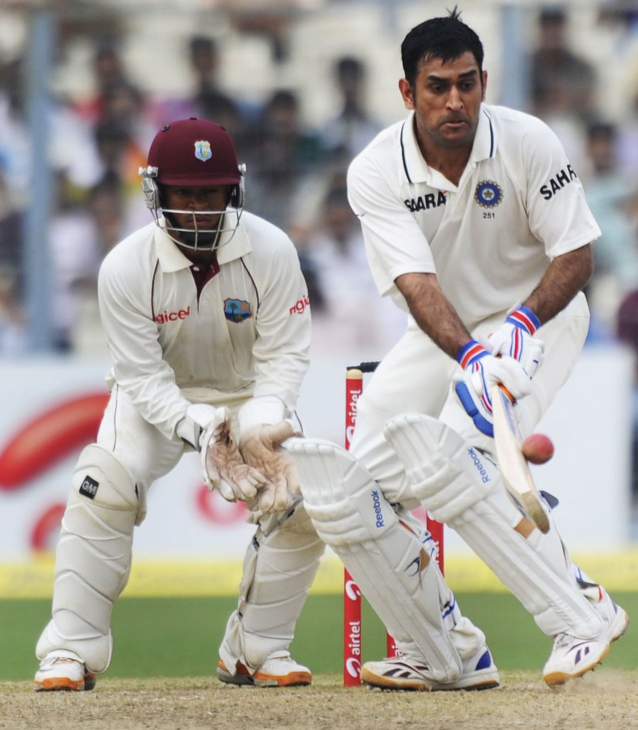 MS Dhoni plays an unorthodox shot, India v West Indies, 2nd Test, Kolkata, 2nd day, November 15, 2011