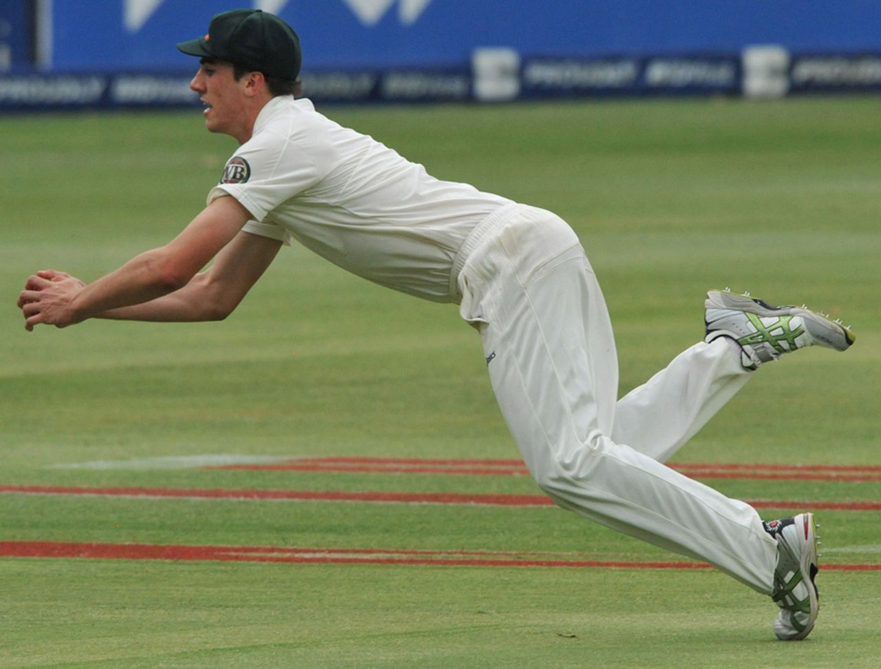 Pat Cummins dives to complete his maiden Test catch, of AB de Villiers, South Africa v Australia, 2nd Test, Johannesburg, 1st day, November 17, 2011