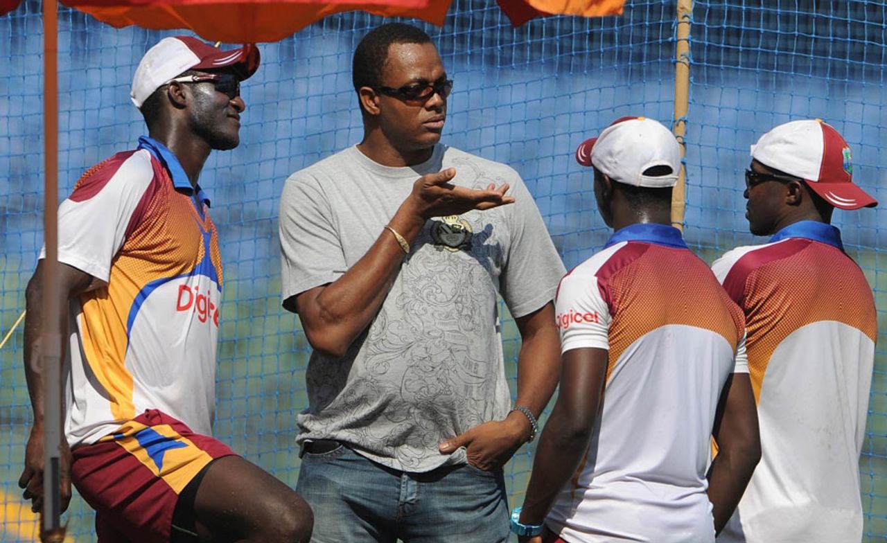 Courtney Walsh talks to members of the West Indian team at a training session, Mumbai, November 20, 2011