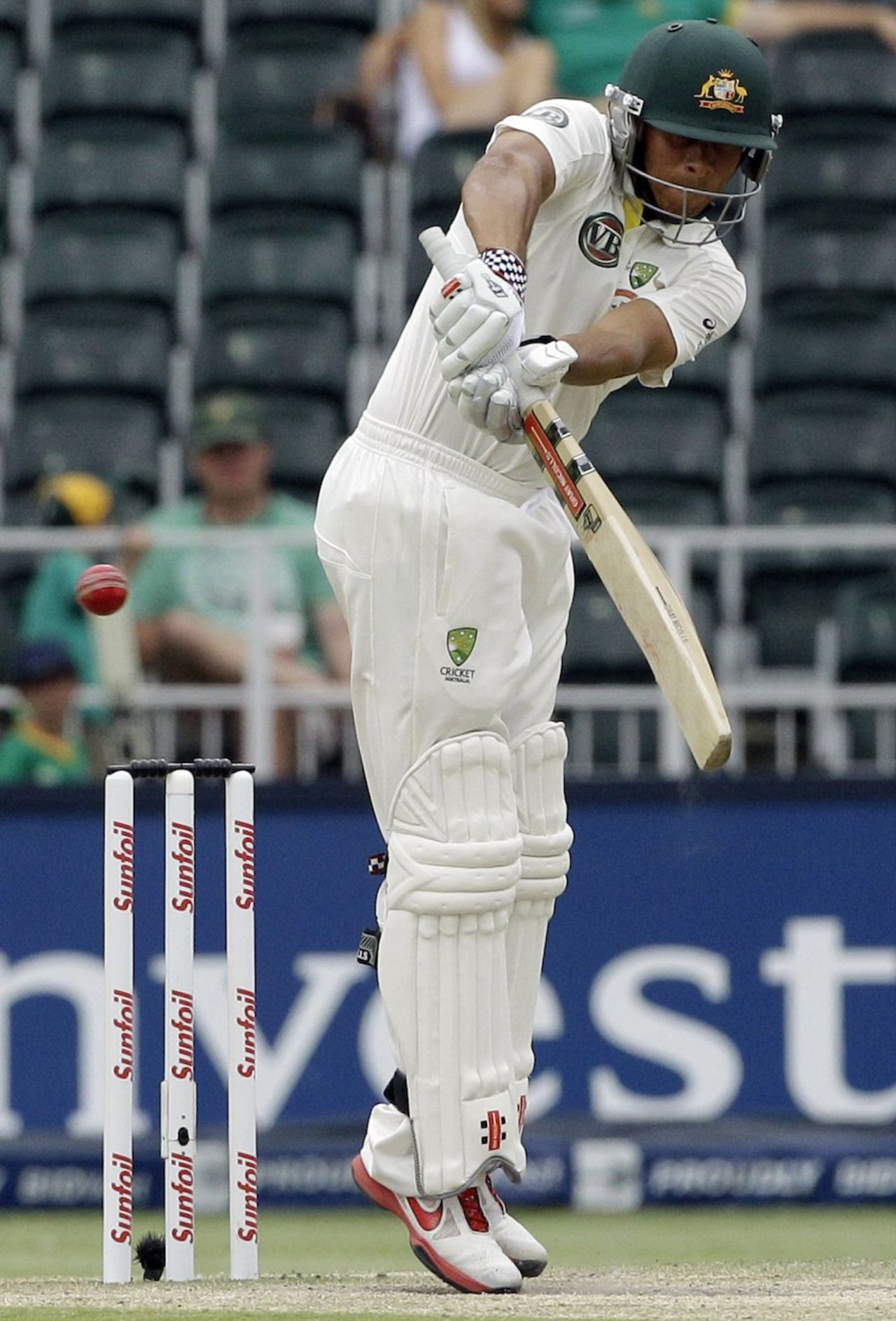 Usman Khawaja stands on his toes to play the ball down, South Africa v Australia, 2nd Test, Johannesburg, 4th day, November 20, 2011