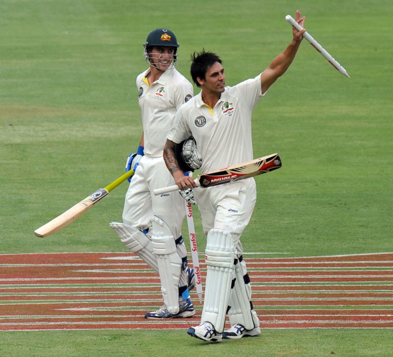 Pat Cummins and Mitchell Johnson walk off after Australia's successful chase, South Africa v Australia, 2nd Test, Johannesburg, 5th day, November 21, 2011