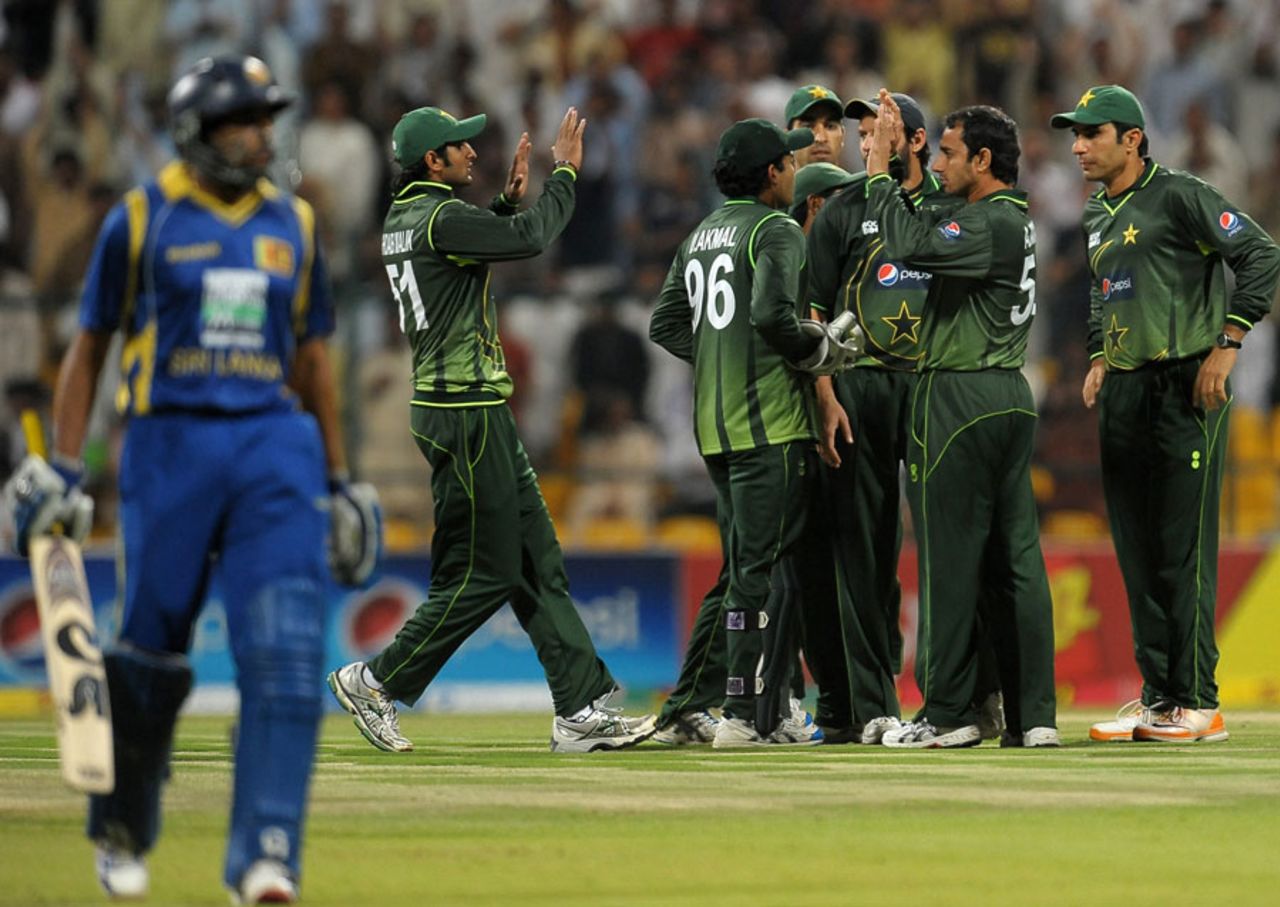 Saeed Ajmal and his mates celebrate the fall of Tillakaratne Dilshan, Pakistan v Sri Lanka, Only T20I, Abu Dhabi, November 25, 2011 