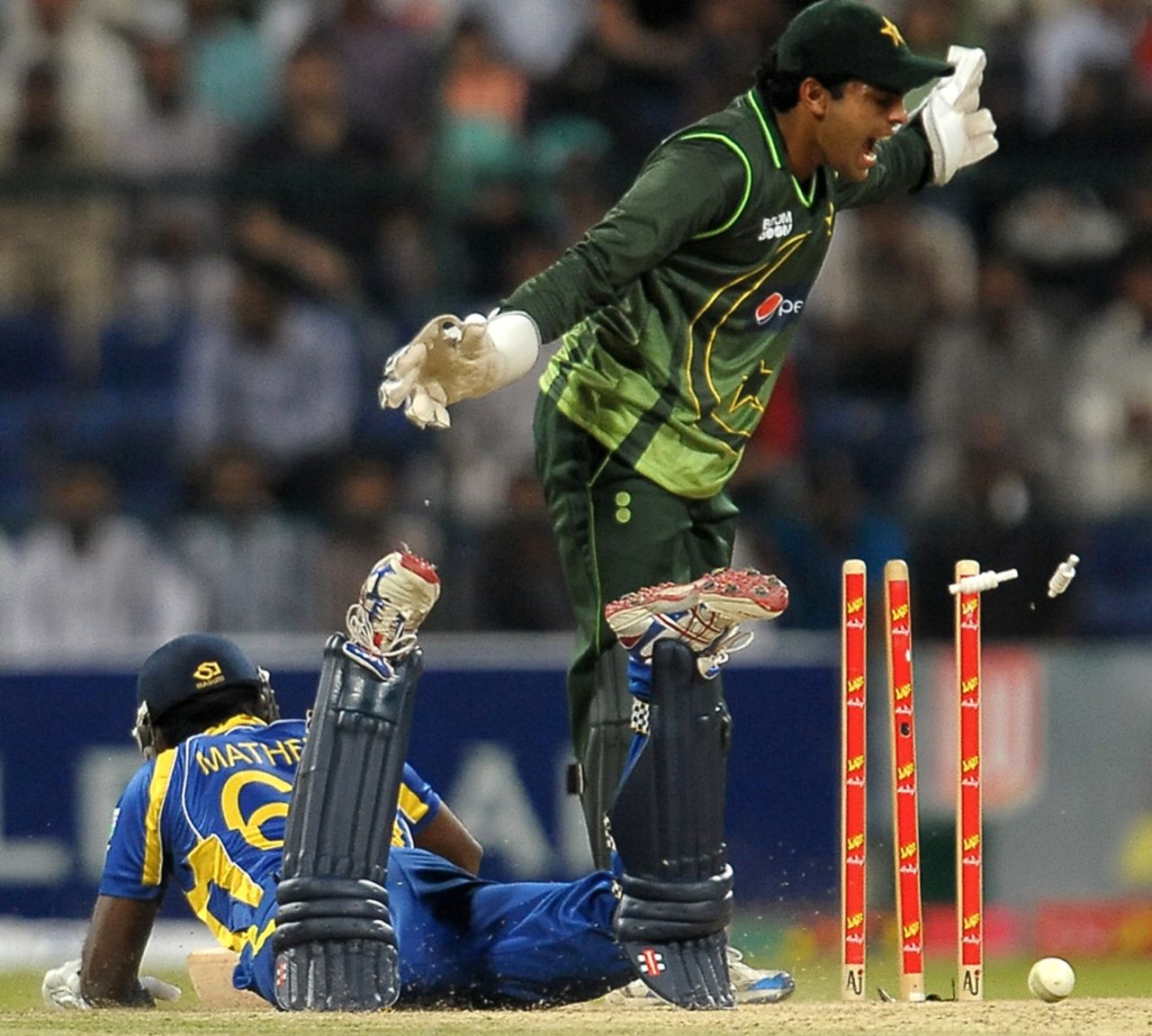 Angelo Mathews is caught short by Misbah-ul-Haq's direct hit, Pakistan v Sri Lanka, Only T20I, Abu Dhabi, November 25, 2011 