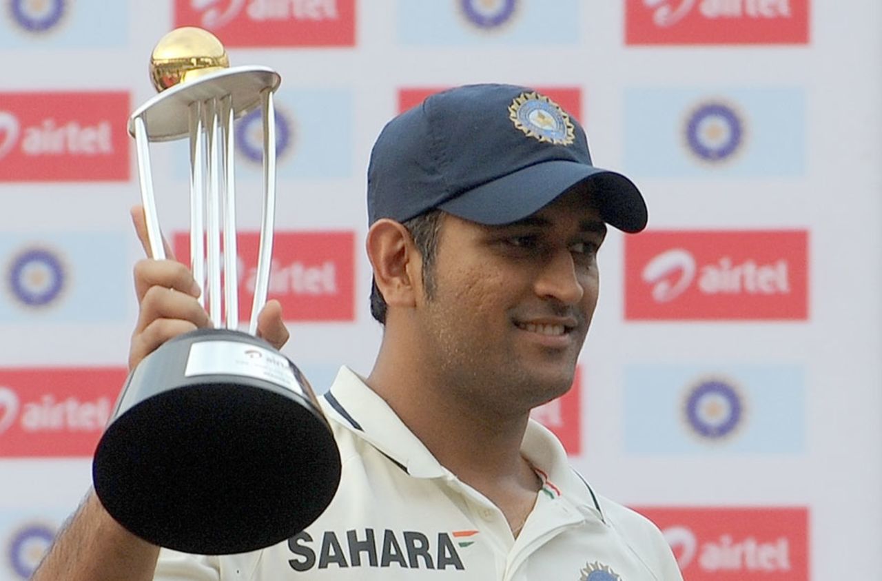 MS Dhoni receives the winners' trophy, India v West Indies, 3rd Test, Mumbai, 5th day, November 26, 2011 