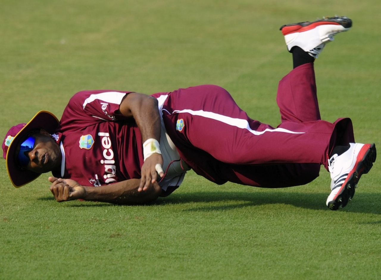 Kieron Pollard dives during fielding practice, Cuttack, November 28, 2011