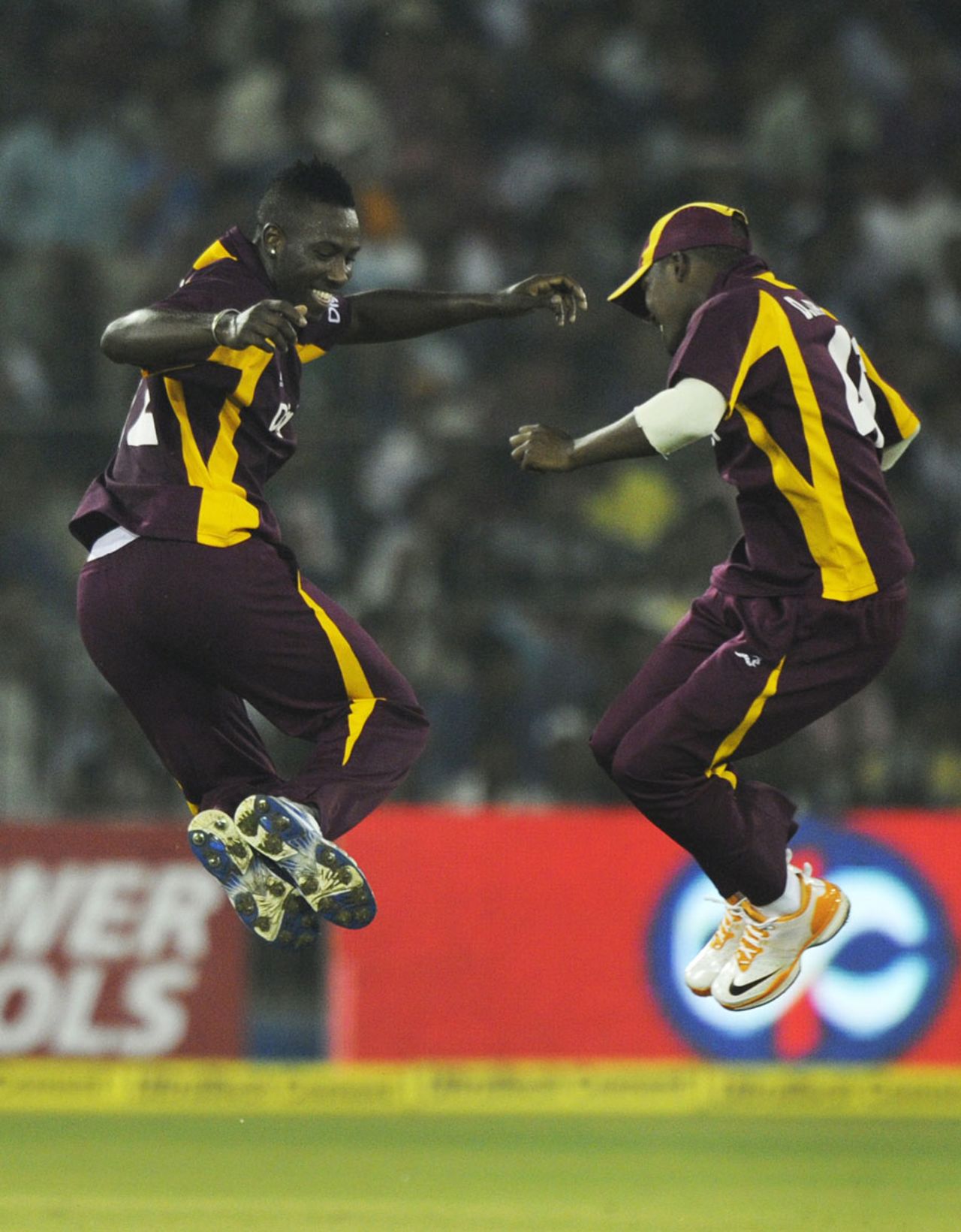 Andre Russell and Darren Bravo celebrate a wicket, India v West Indies, 1st ODI, Cuttack, November 29, 2011