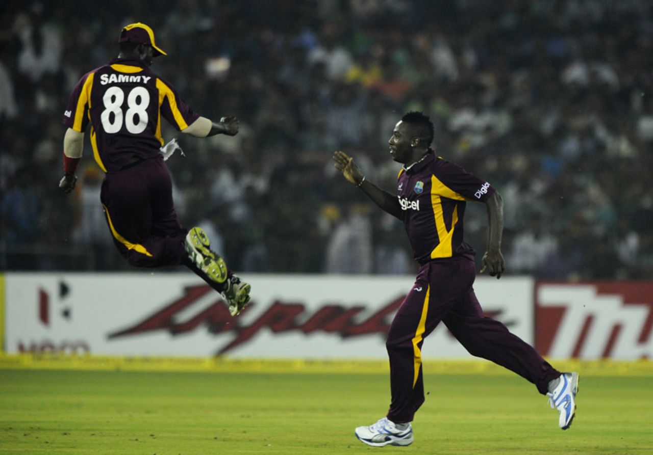 Darren Sammy and Andre Russell are pumped up after a wicket, India v West Indies, 1st ODI, Cuttack, November 29, 2011