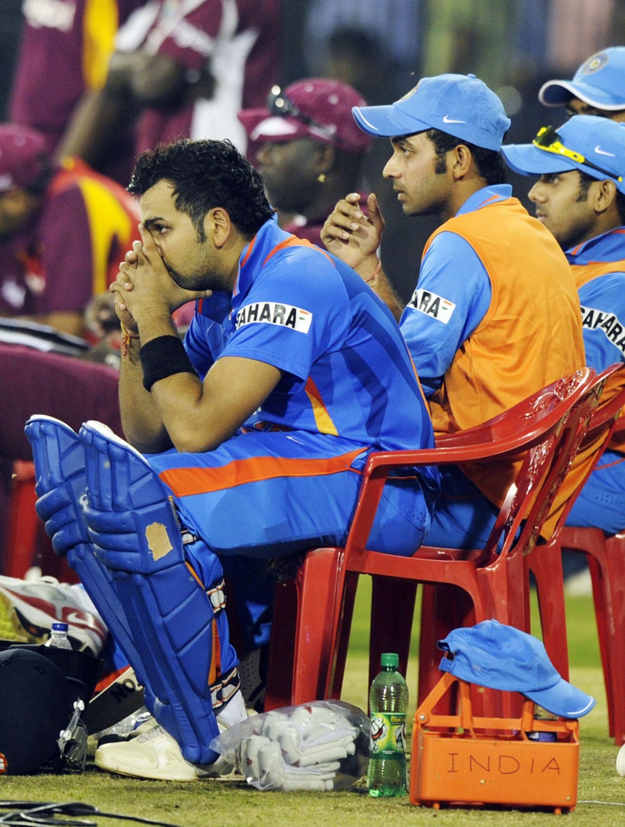 India's players watch the match, as it nears its conclusion, from the sidelines, India v West Indies, 1st ODI, Cuttack, November 29, 2011
