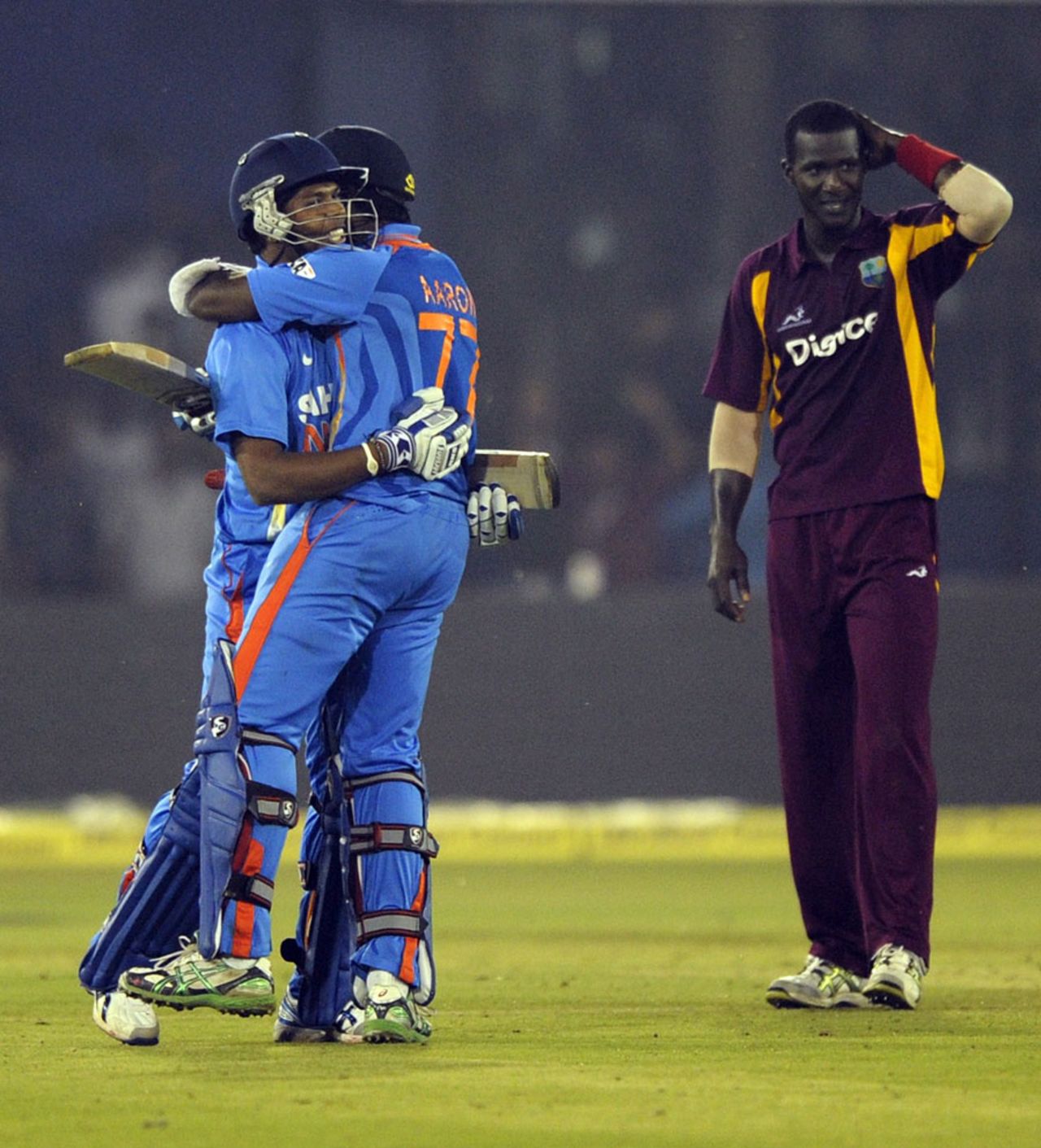Umesh Yadav and Varun Aaron celebrate taking India to victory, India v West Indies, 1st ODI, Cuttack, November 29, 2011