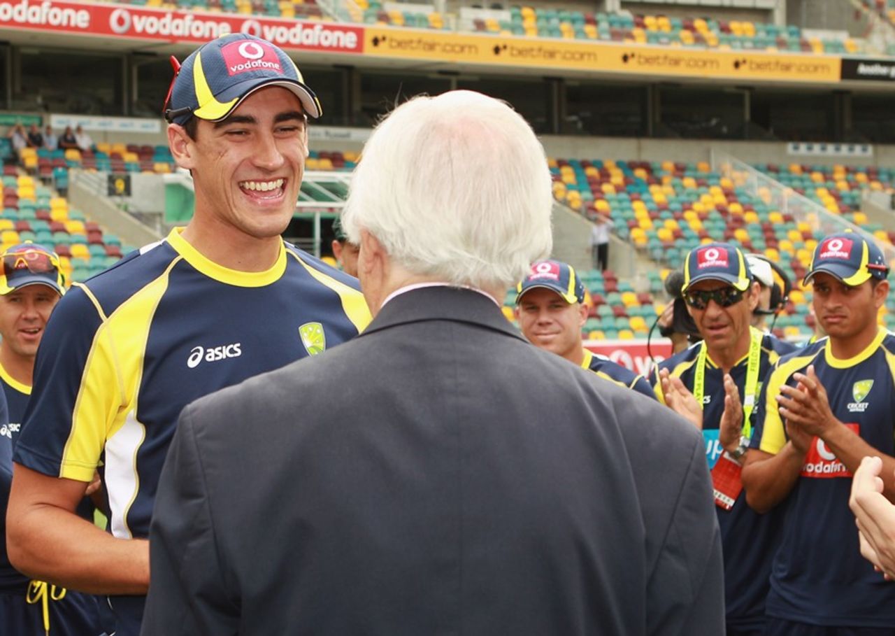 Richie Benaud presents Mitchell Starc with his baggy green, Australia v New Zealand, 1st Test, Brisbane, 1st day, December 1, 2011