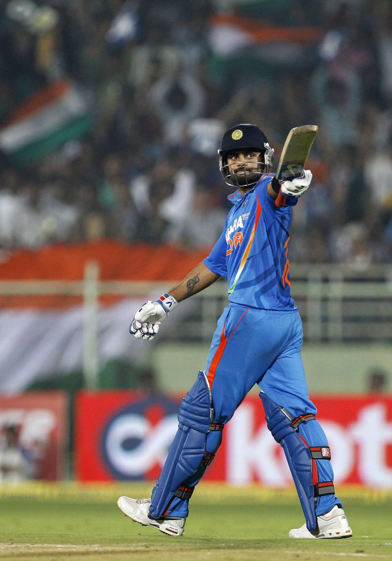 Virat Kohli acknowledges the applause on getting to a fifty, India v West Indies, 2nd ODI, Visakhapatnam, December 2, 2011