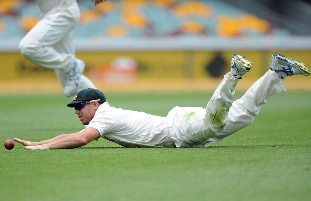 David Warner makes a diving stop in the field, Australia v New Zealand, 1st Test, Brisbane, 4th day, December 4, 2011