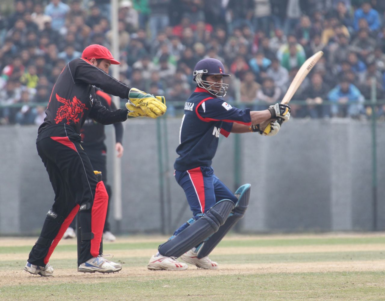 Nepal's Gyanendra Malla cuts the ball for four against Hong Kong during the ACC Twenty20 Cup 2011 match at Tribhuvan University Ground in Kathmandu on 3rd December 2011 