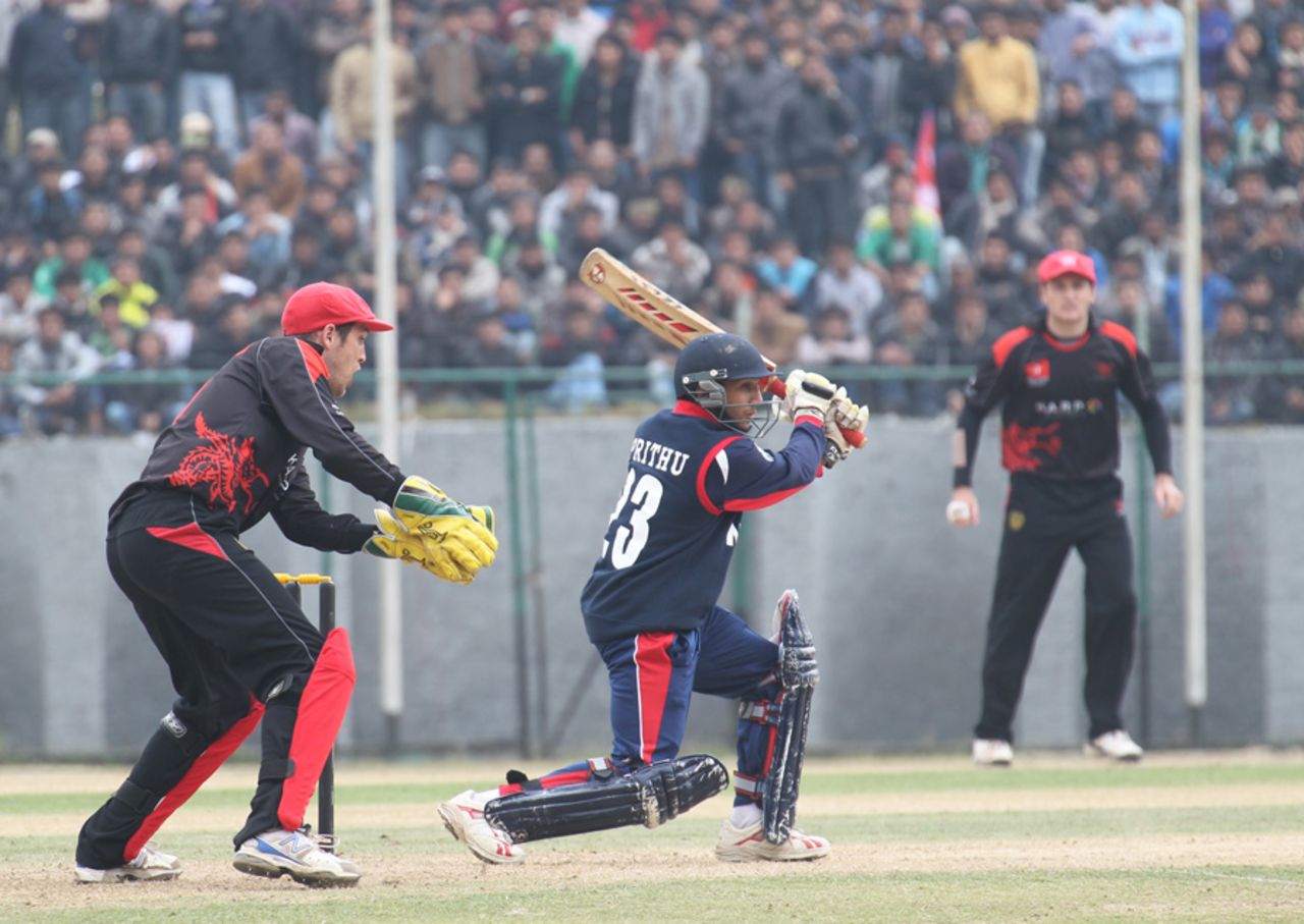 Nepal's Prithu Baskota drives the ball into the covers against Hong Kong during the ACC Twenty20 Cup 2011 match at Tribhuvan University Ground in Kathmandu on 3ed December 2011