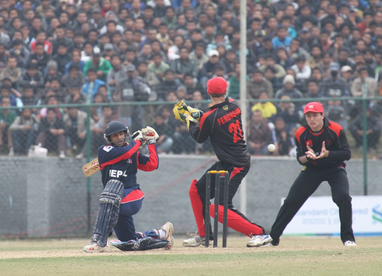 Nepal's Prithu Baskota fails to connect with a sharply turning ball that is taken by Jamie Atkinson at first slip during the ACC Twenty20 Cup 2011 in Kathmandu on 3rd December 2011