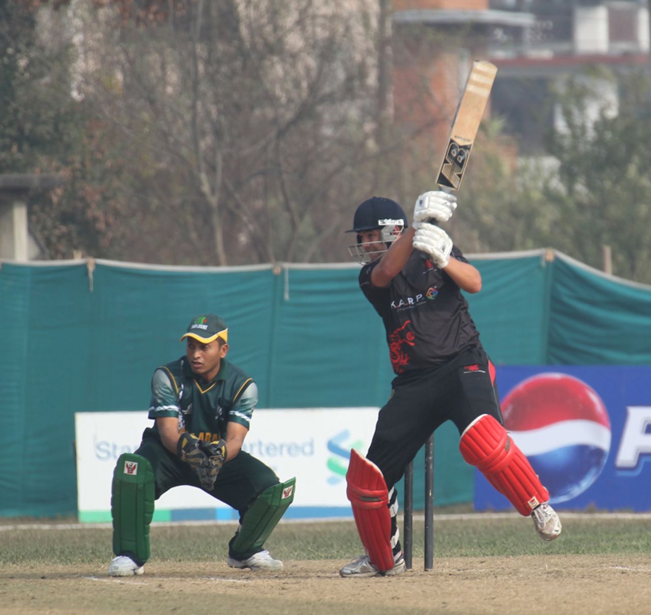 Courtney Kruger cuts the ball away during his innings of 38 against Saudi Arabia at the ACC Twenty20 Cup 2011 in Kathmandu on 5th December 2011