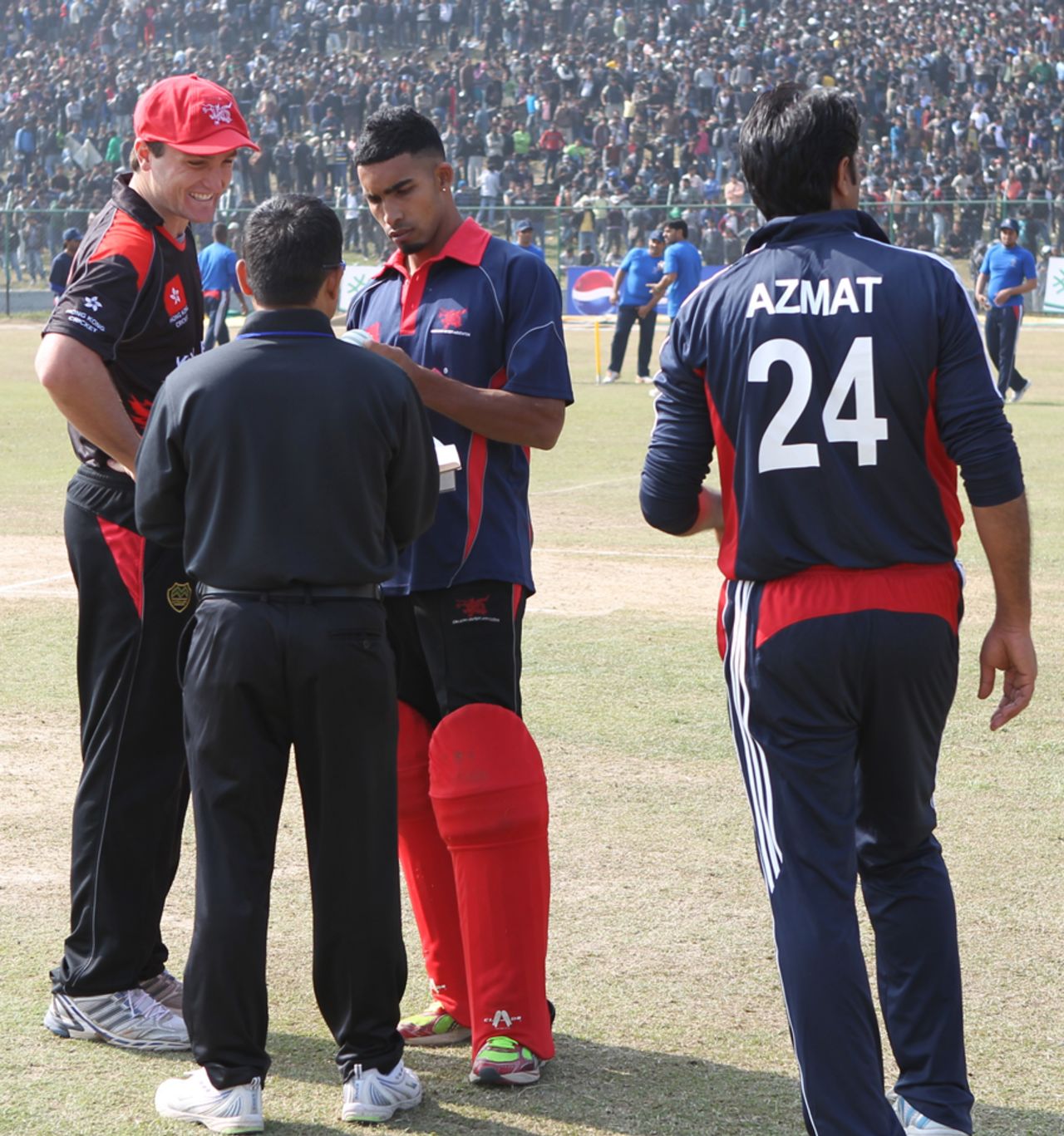 Jamie Atkinson and Irfan Ahmed select the match ball before the start of play against Kuwait at the ACC Twenty20 Cup 2011 in Kathmandu