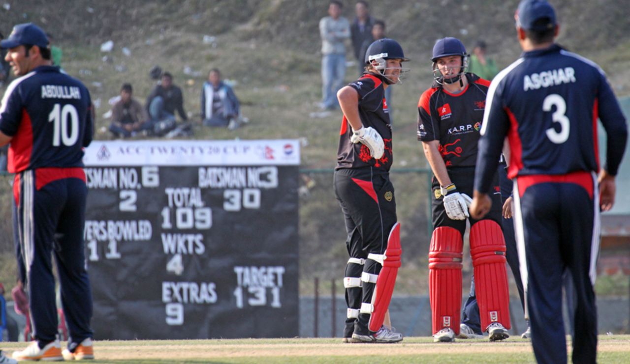 Courtney Kruger and Jamie Atkinson look to finish things off for Hong Kong against Kuwait at the ACC Twenty20 Cup 2011 in Kathmandu on 7th December 2011