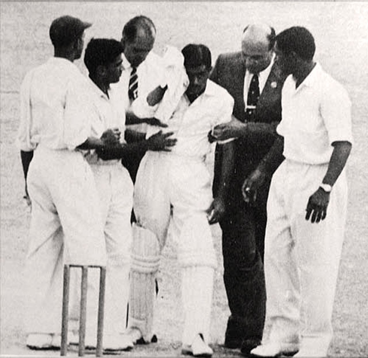 Nari Contractor is led off after being struck by Charlie Griffith, Barbados v Indians, March 17, 1962