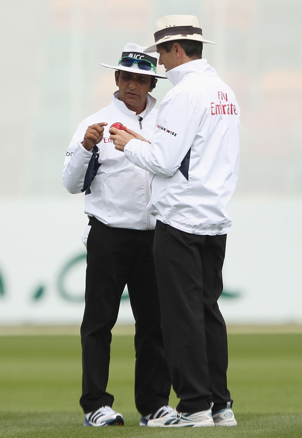 Asad Rauf and Nigel Llong inspect the ball, Australia v New Zealand, second Test, Hobart, 3rd day, December 11 2011