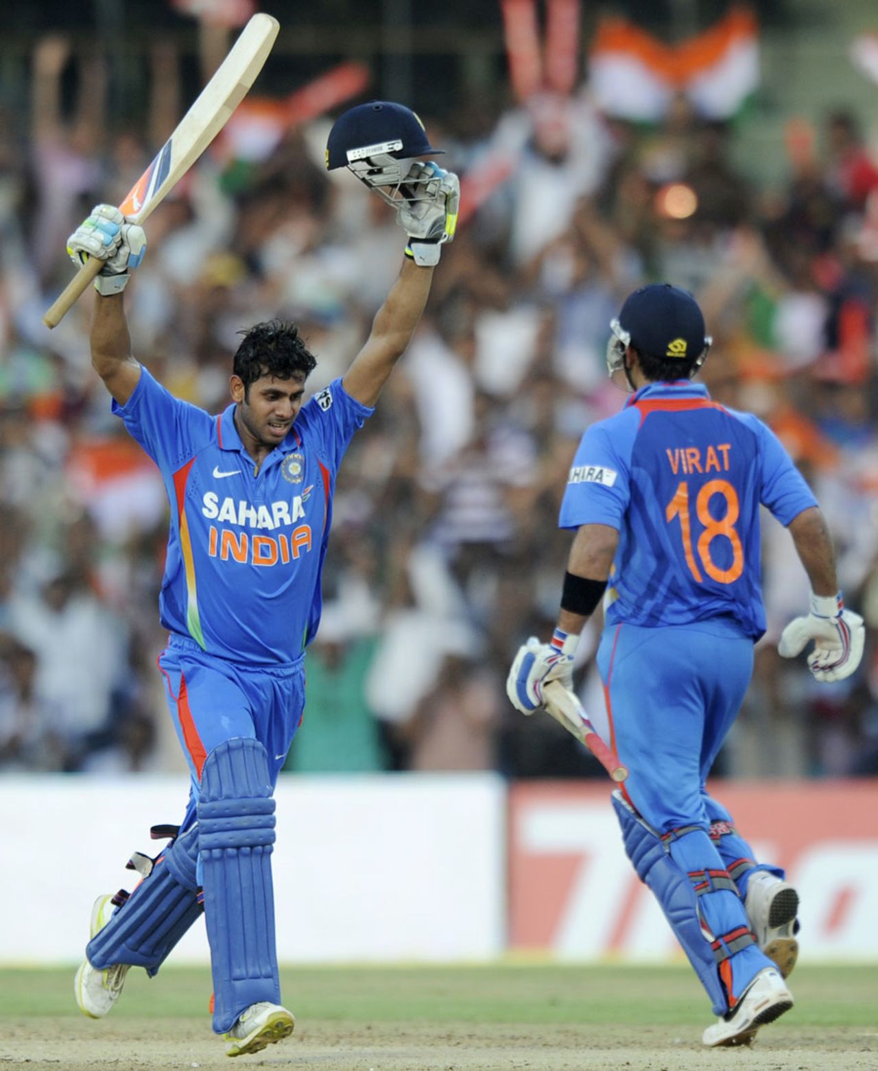 Manoj Tiwary raises his arms after reaching his century, India v West Indies, 5th ODI, Chennai, December 11, 2011