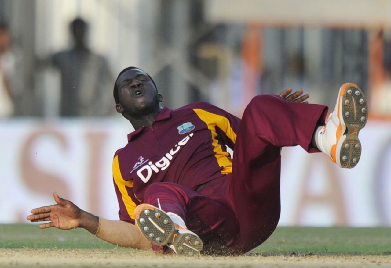 Darren Sammy reacts after failing to stop a ball, India v West Indies, 5th ODI, Chennai, December 11, 2011
