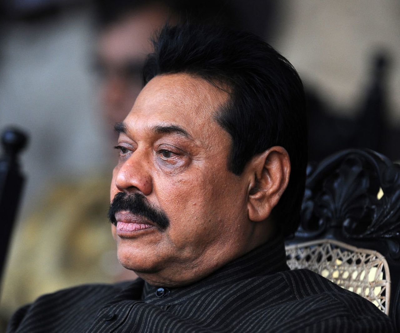 Sri Lanka's president Mahinda Rajapaksa watches a cricket match between parliamentarians, Colombo, December 11, 2011