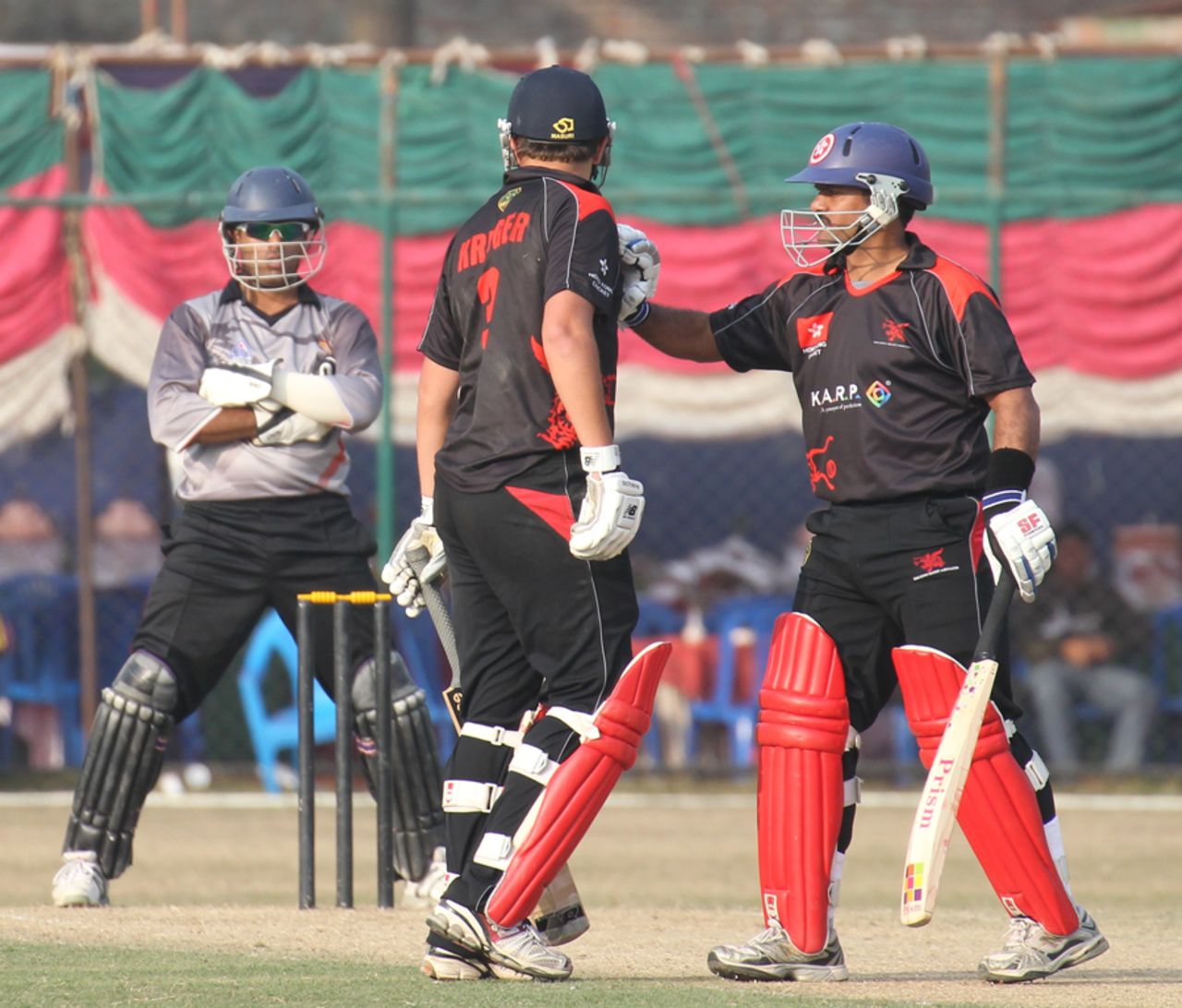 Moner Ahmed intervenes after Courtney Kruger and UAE's Abdul Rehman exchange a few pleasantries at the ACC Twenty20 Cup 2011 played on Kathmandu on 6th December 2011