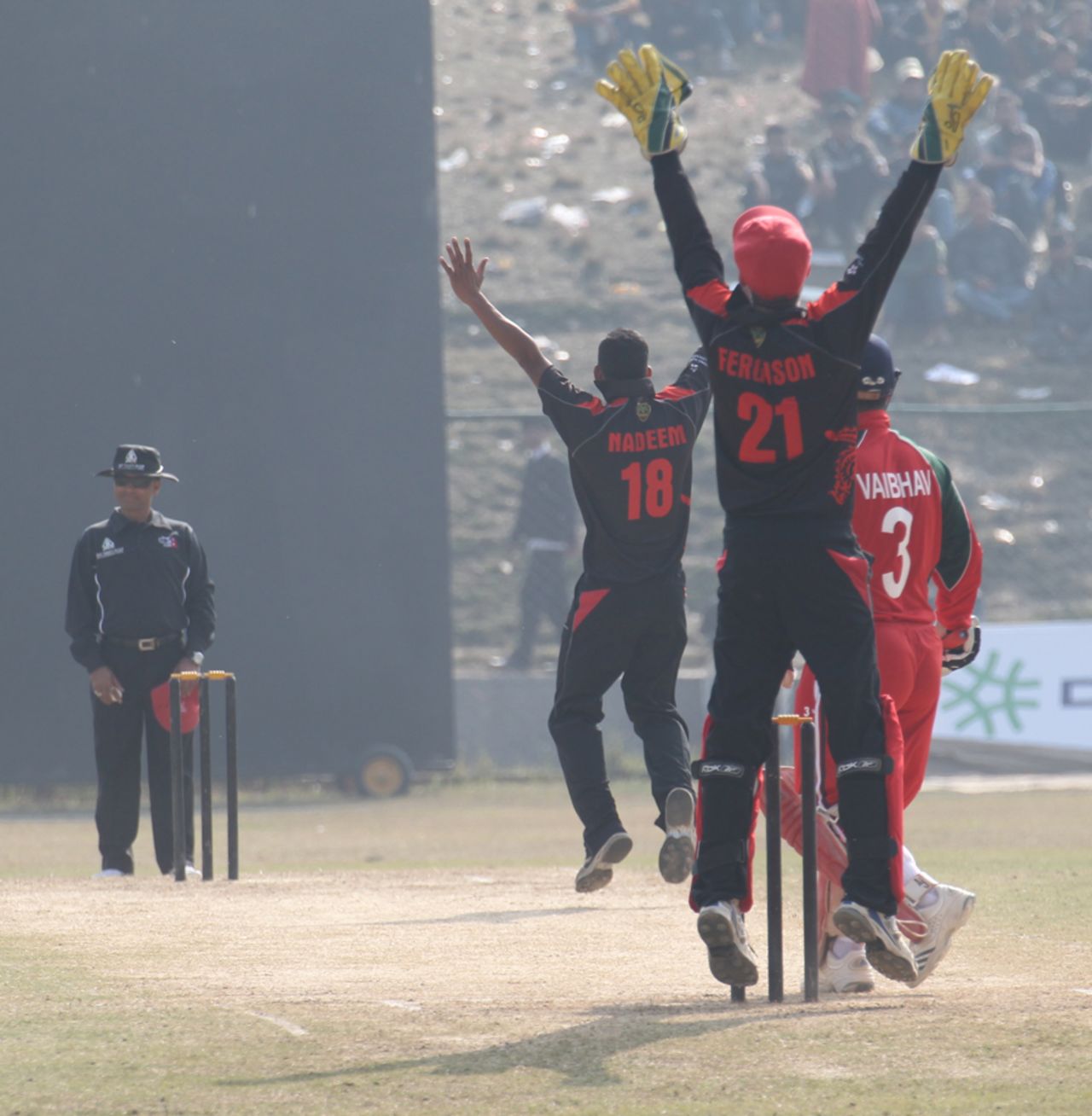 Nadeem Ahmed and Mark Ferguson appeal unsuccessfully for LBW during the ACC Twenty20 Cup 2011 semi-final against Oman in Kathmandu on 9th December 2011