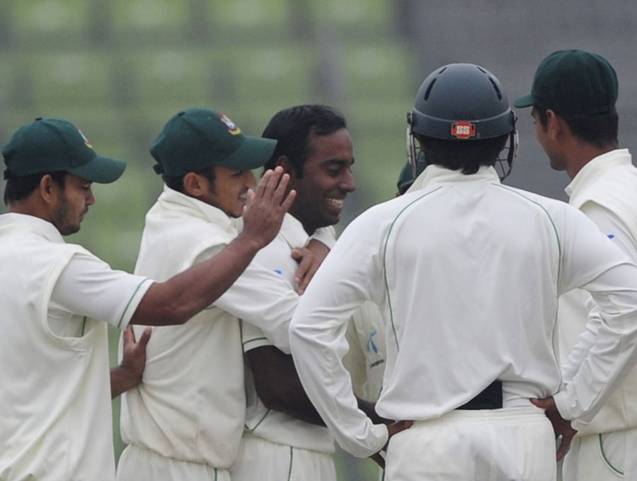 Elias Sunny is congratulated after dismissing Younis Khan, Bangladesh v Pakistan, 2nd Test, Mirpur, 4th day, December 20, 2011 
