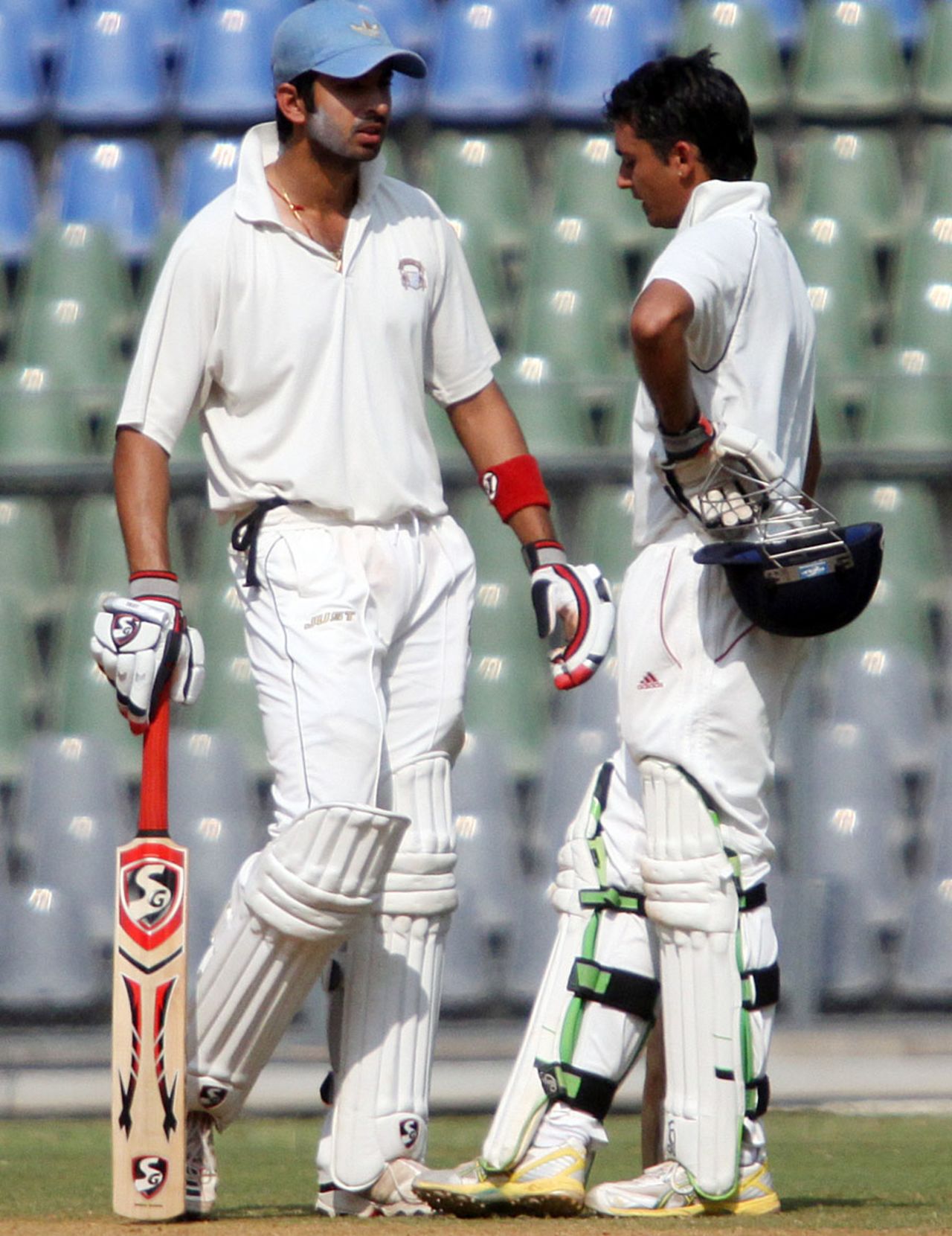 Mayank Sidhana and Uday Kaul have a chat during their stand of 124, Mumbai v Punjab, Ranji Trophy Elite, Mumbai, 3rd day, December 23, 2011