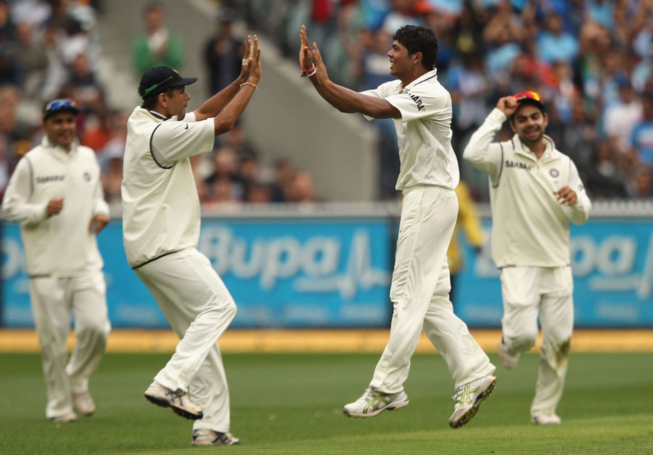 Umesh Yadav and Rahul Dravid celebrate a wicket, Australia v India, 1st Test, Melbourne, 1st day, December 26, 2011