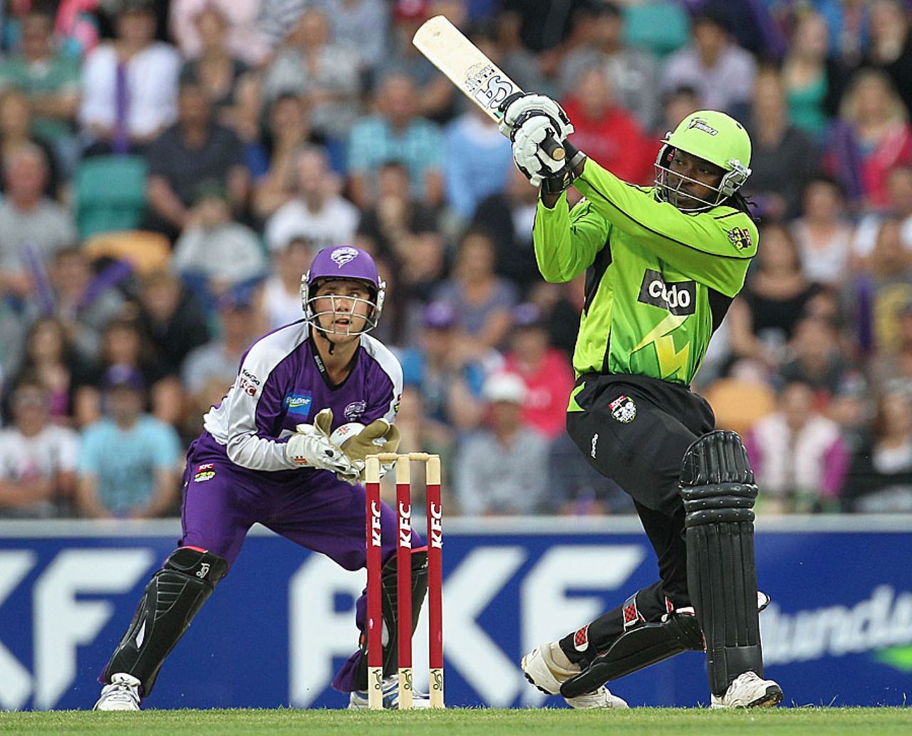 Chris Gayle launches one to the leg side, Hobart Hurricanes v Sydney Thunder, BBL, Hobart, January 1, 2012