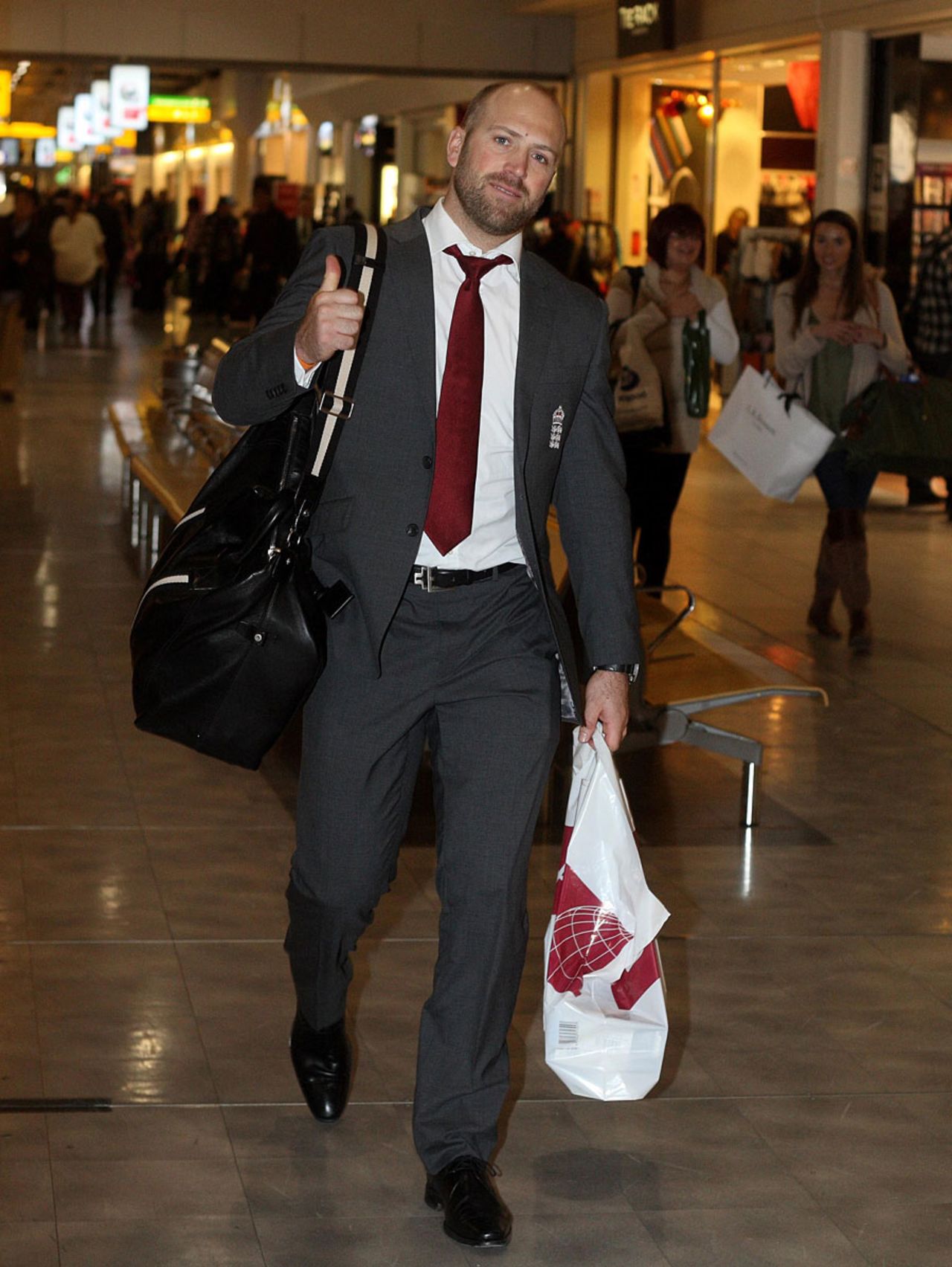 Matt Prior gives a thumbs up as he heads through the airport, Heathrow, January 2, 2012