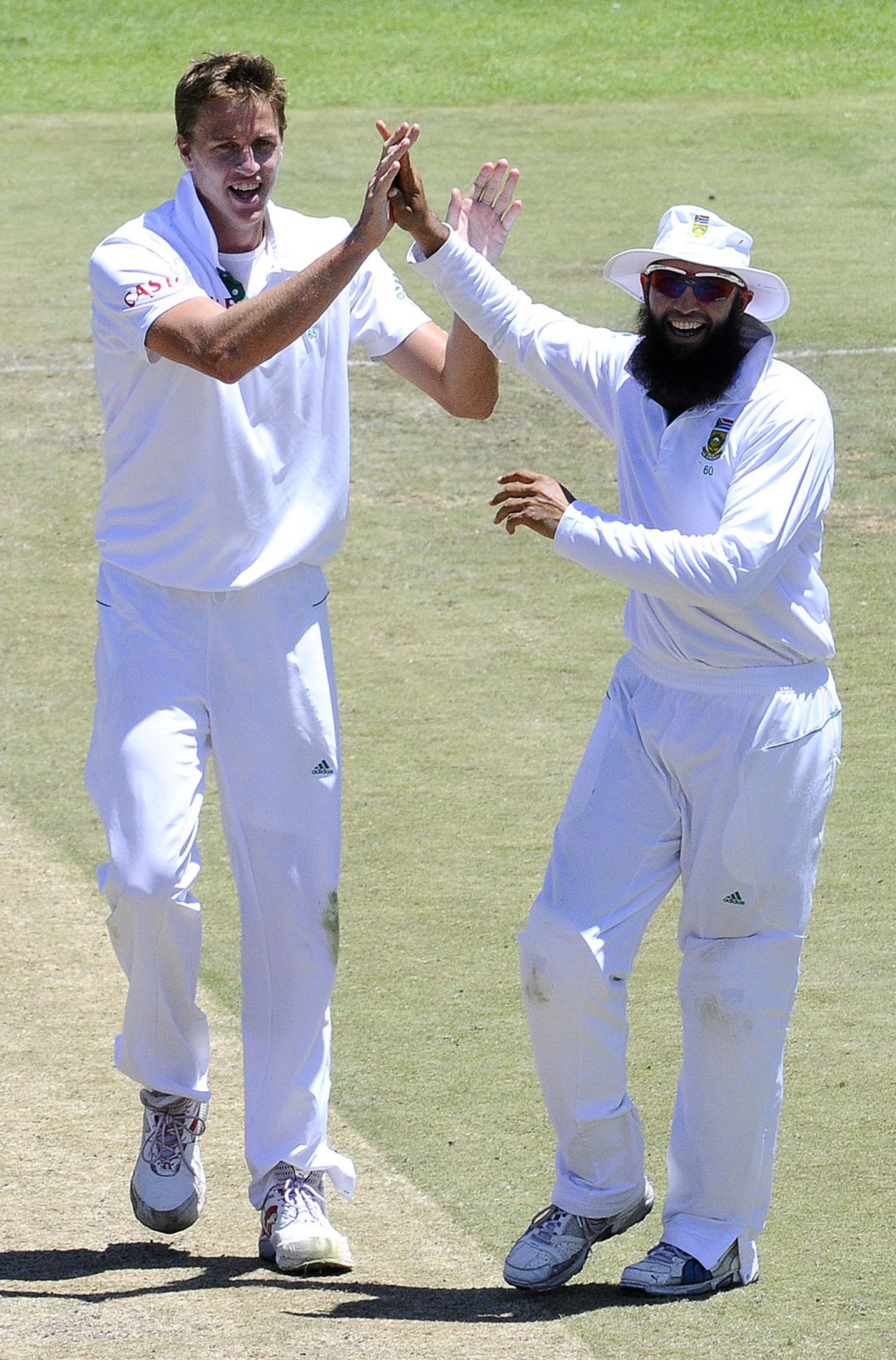 Morne Morkel celebrates the wicket of Dinesh Chandimal with Hashim Amla, South Africa v Sri Lanka, 3rd Test, Cape Town, January, 5, 2012