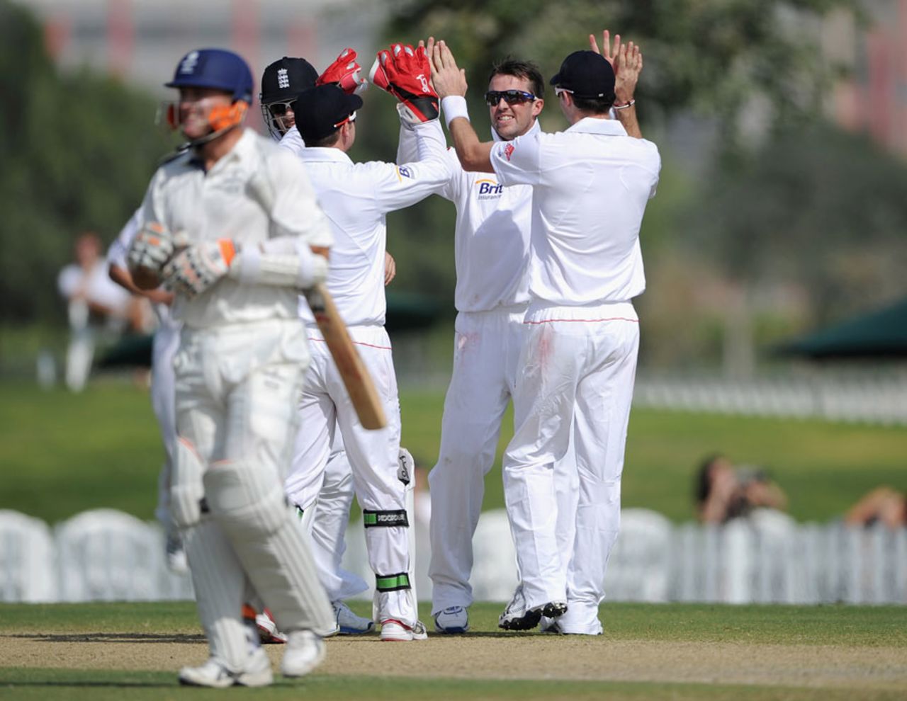 England celebrate the wicket of Craig Williams, caught behind off Graeme Swann, ICC Combined XI v England XI, Dubai, 1st day, January 7, 2012