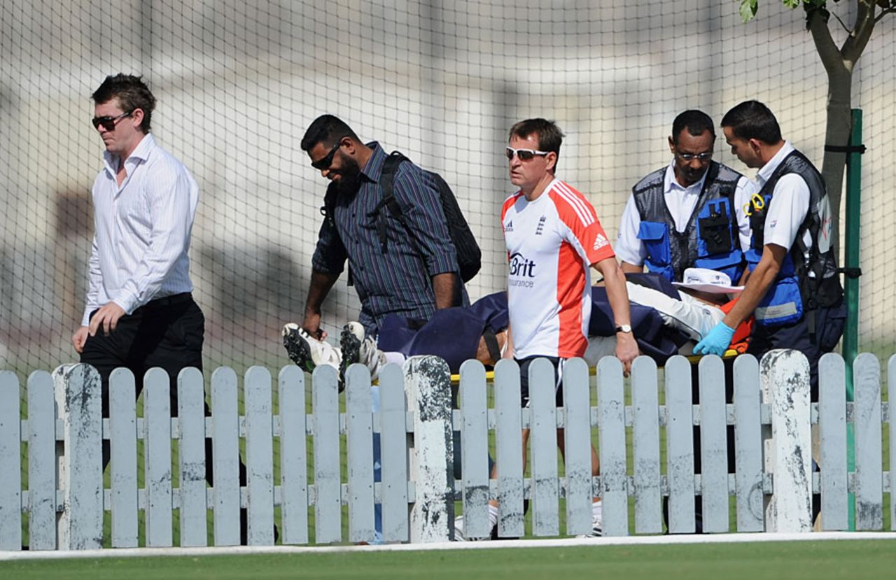 An injured Hamid Hassan is carried around the boundary, ICC Combined XI v England XI, Dubai, 2nd day, January 8, 2012