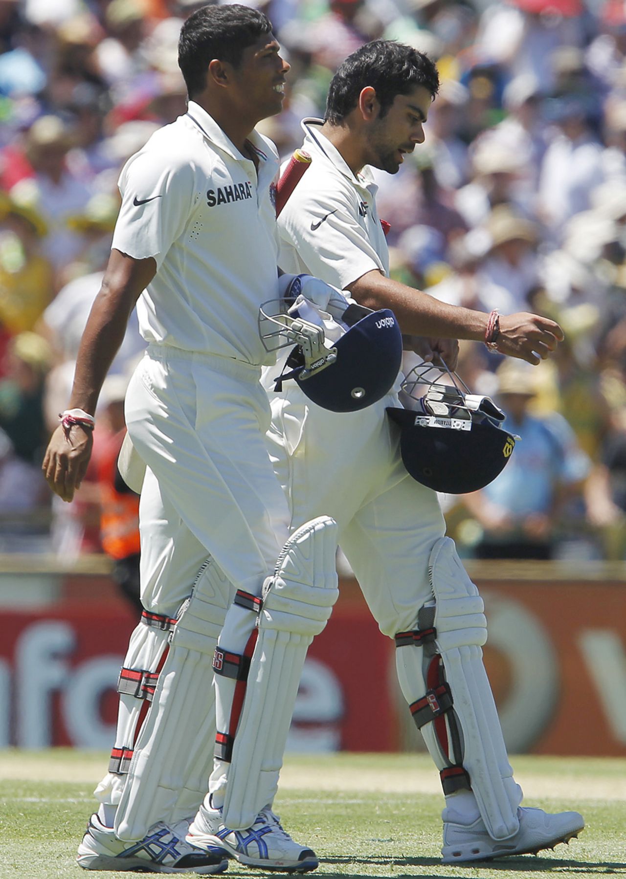 Umesh Yadav and Virat Kohli walk back after India's innings defeat, Australia v India, 3rd Test, Perth, 3rd day, January 15, 2012