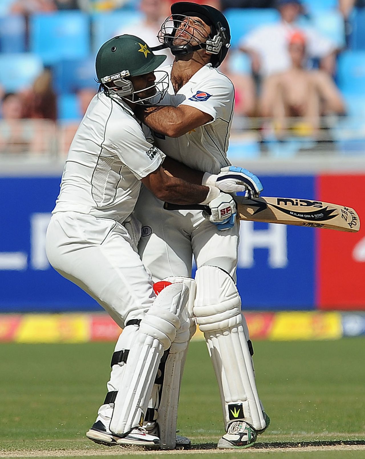 Mohammad Hafeez and Taufeeq Umar kept their eyes on the ball but not at each other, Pakistan v England, 1st Test, Dubai, 2nd day, January 18, 2012
