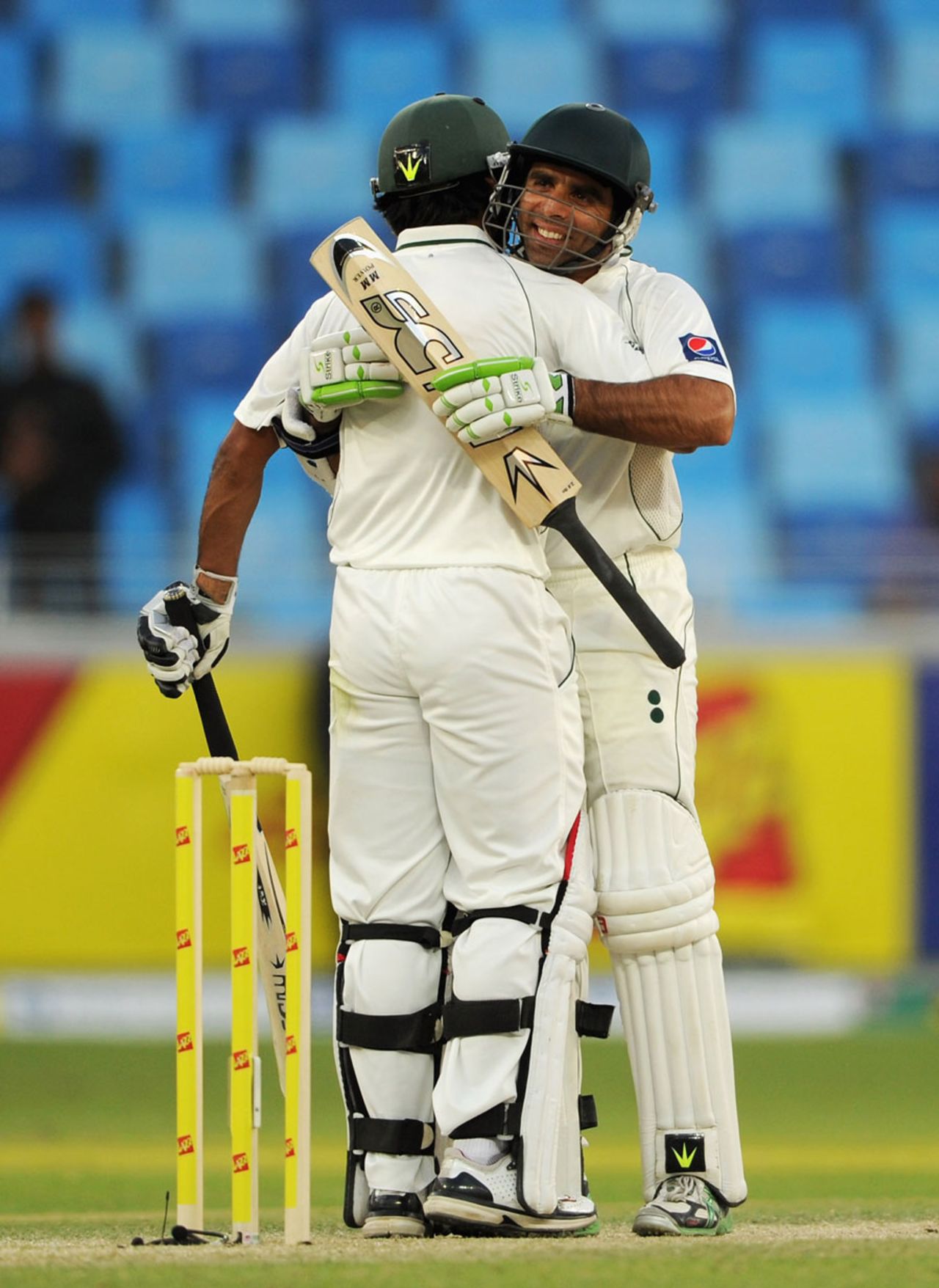 Taufeeq Umar and Mohammad  Hafeez embrace after knocking off the 15-run target, Pakistan v England, 1st Test, Dubai, 3rd day, January 19, 2012