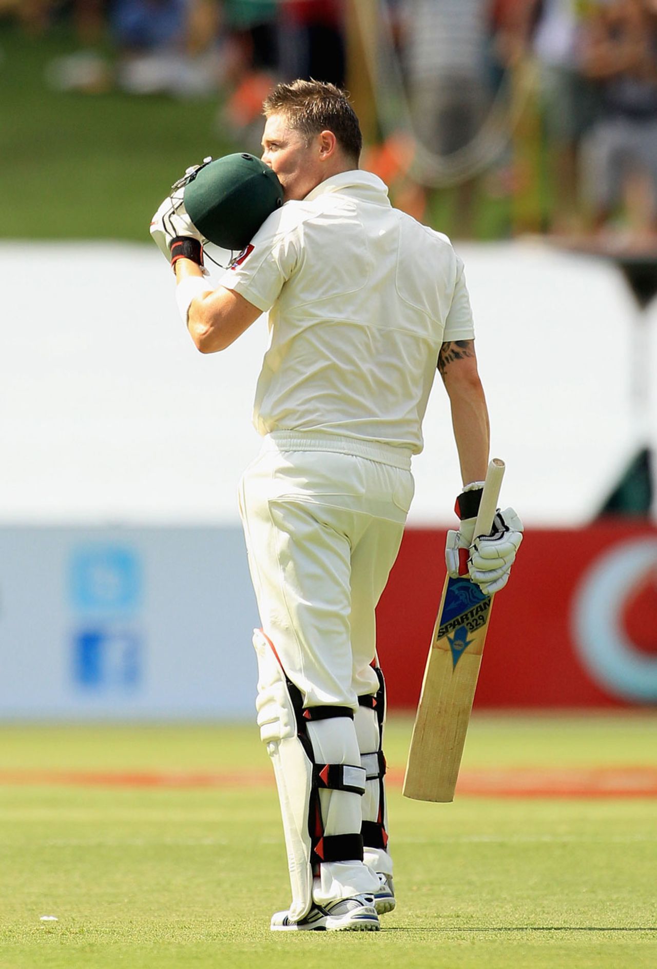 Michael Clarke kisses the Australia crest after completing his century, Australia v India, 4th Test, Adelaide, 1st day, January 24, 2012