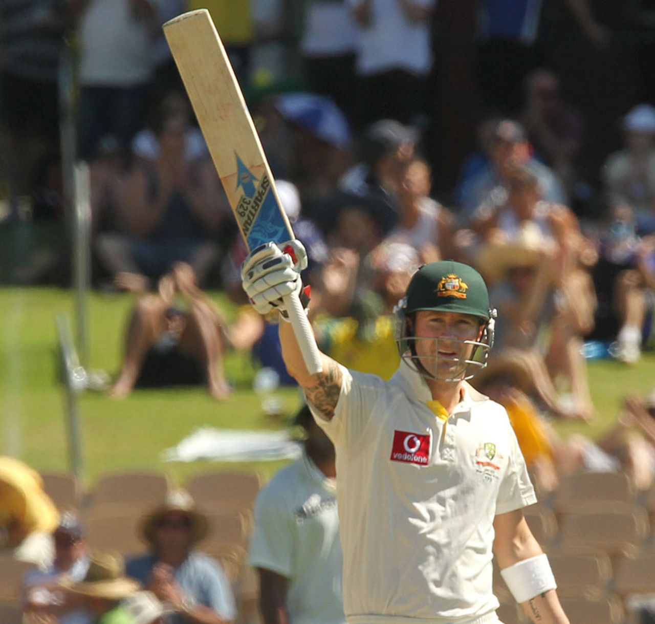 An increasing familiar sight this series: Michael Clarke salutes the crowd after another landmark, Australia v India, 4th Test, Adelaide, 2nd day, January 25, 2012