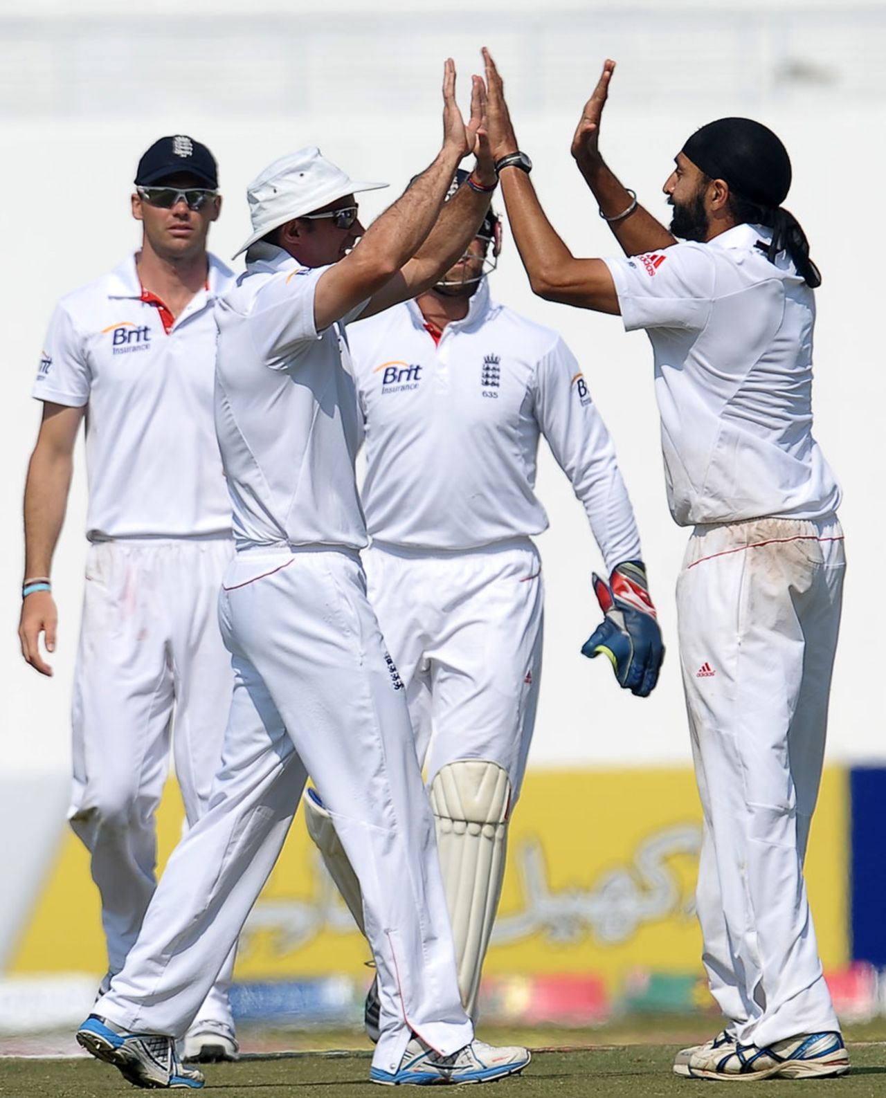 England congratulate Monty Panesar on his 6-for, Pakistan v England, 2nd Test, Abu Dhabi, 4th day, January 28, 2012