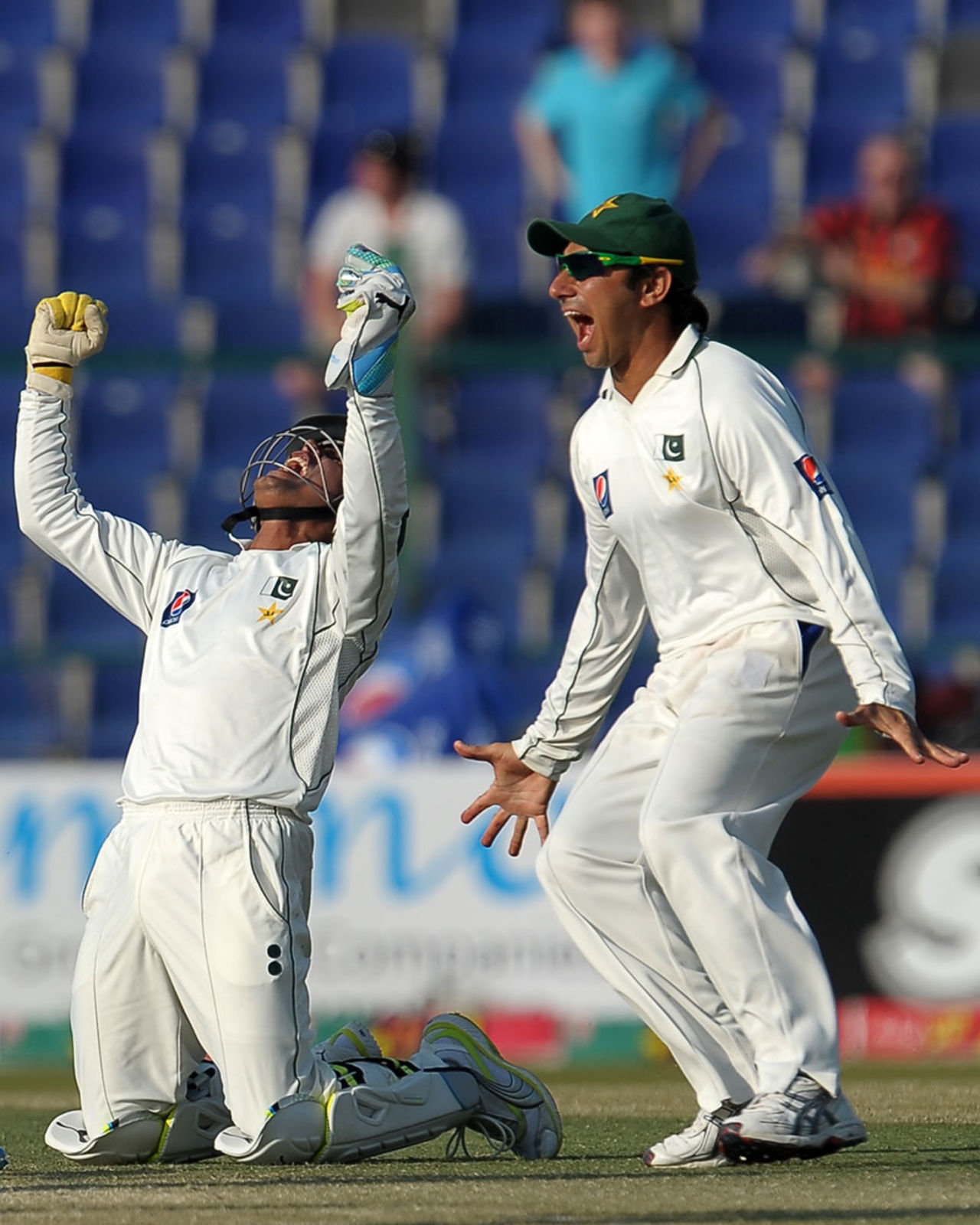 Adnan Akmal and Saeed Ajmal celebrate Pakistan's victory, Pakistan v England, 2nd Test, Abu Dhabi, 4th day, January 28, 2012