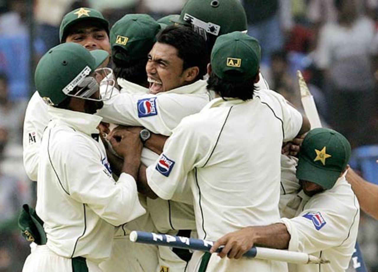Danish Kaneria celebrating  a fantastic victory with his teammates after he claimed the wicket of Laxmipathy Balaji to seal the win, India v Pakistan, 3rd Test, Bangalore, 5th day, March 28, 2005
