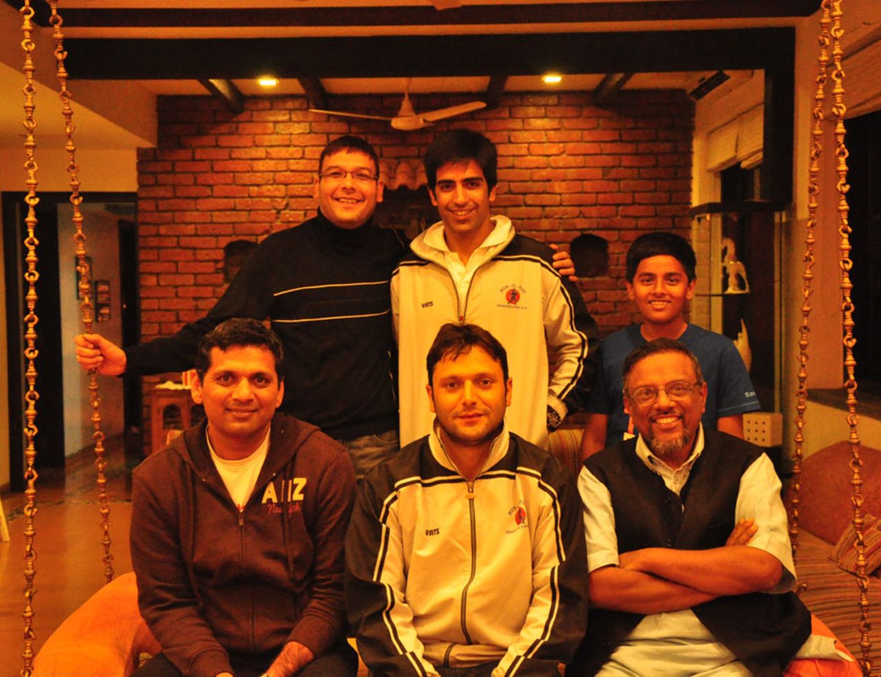 Devang Gandhi (sitting left) along with cricketers from Kashmir and cricket writer Mudar Patherya (sitting right), Kolkata