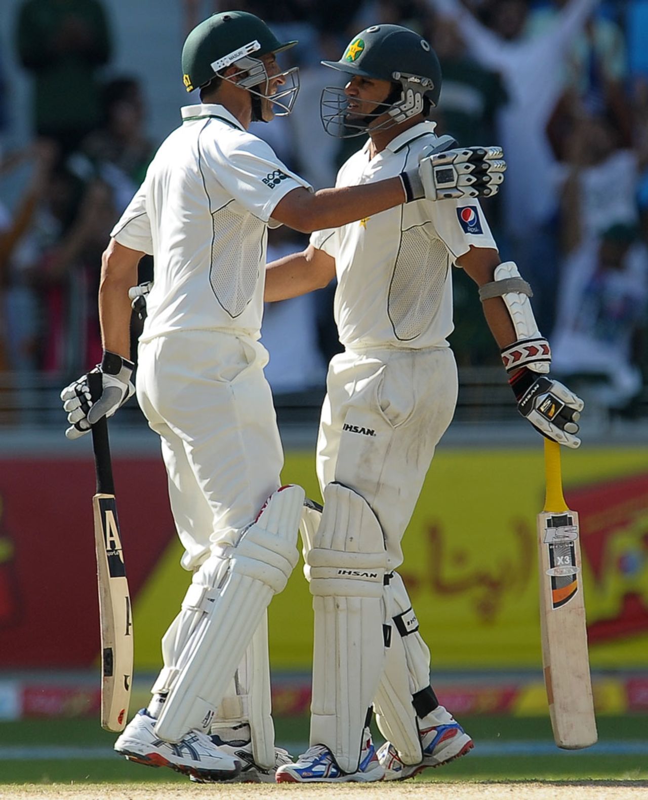 Younis Khan congratulates Azhar Ali on his half-century, Pakistan v England, 3rd Test, Dubai, February 4, 2012 