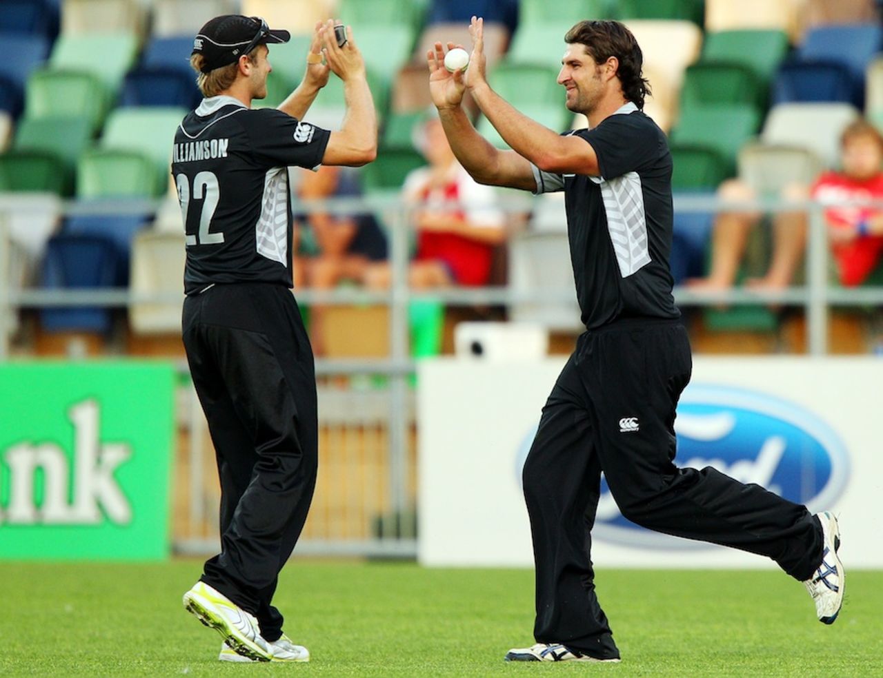 Colin de Grandhomme and Kane Williamson celebrate a wicket, New Zealand v Zimbabwe, 3rd ODI, Napier, February 9, 2012