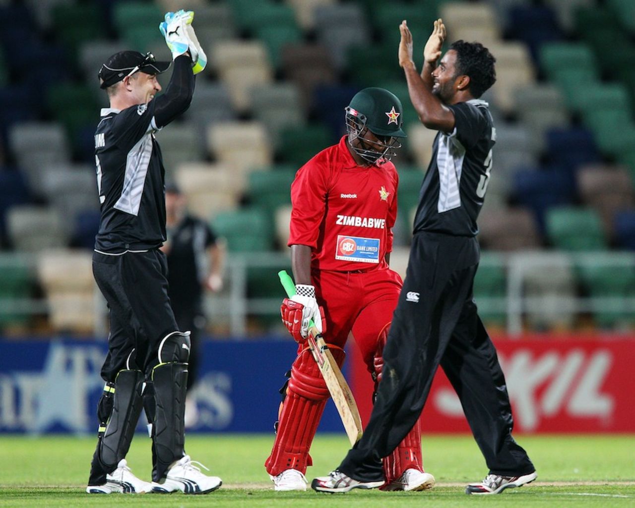Tarun Nethula and Brendon McCullum celebrate Prosper Utseya's wicket, New Zealand v Zimbabwe, 3rd ODI, Napier, February 9, 2012