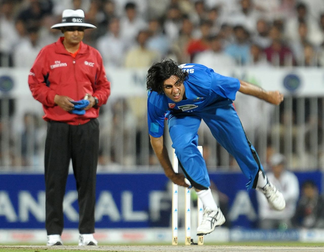 Shapoor Zadran follows through after delivering a ball, Afghanistan v Pakistan, one-off ODI, Sharjah, February 10, 2012